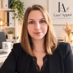 Laura E.