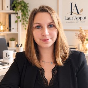 Laura E.